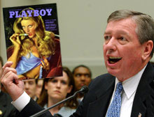 Attorney General and bible thumper extraordinaire John Ashcroft shows off the Vintage 1973 Playboy he won on eBay.